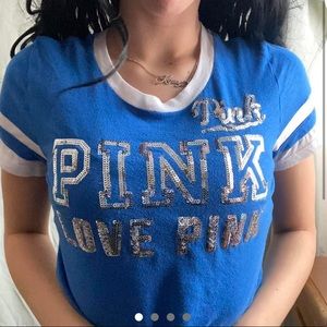 A blue, white striped, Pink Victoria's Secret shirt.